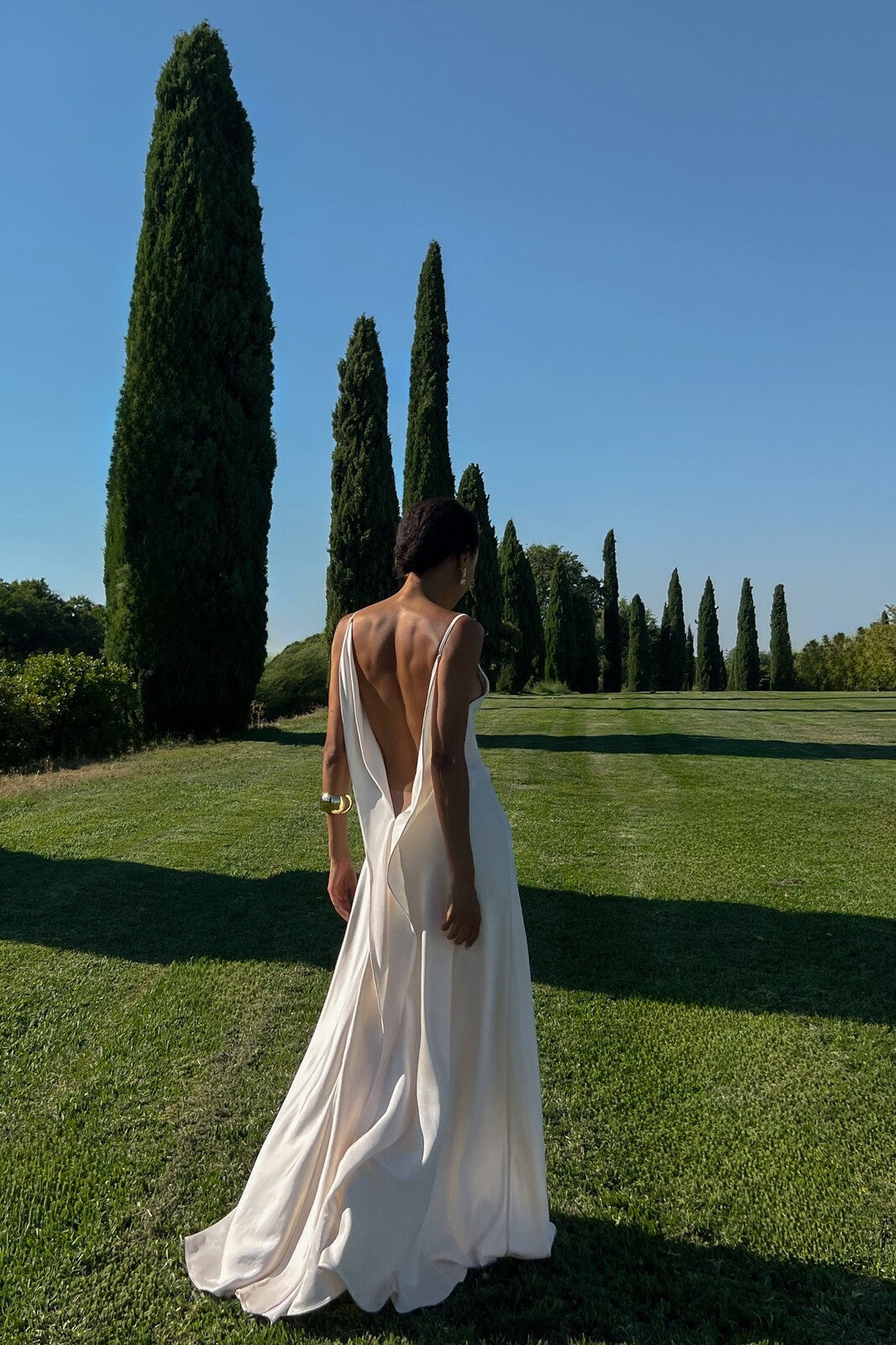 Off-white dress with deep back neckline.