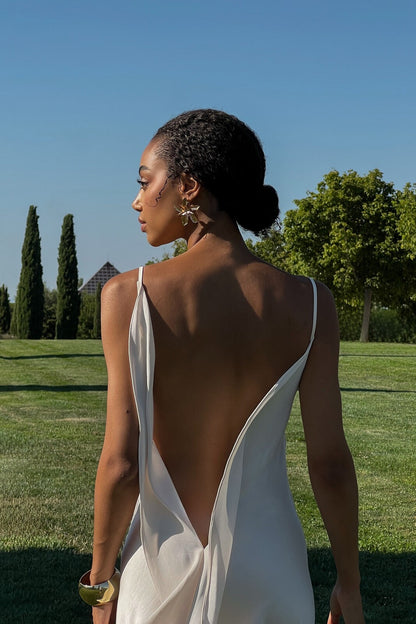 Off-white dress with deep back neckline.