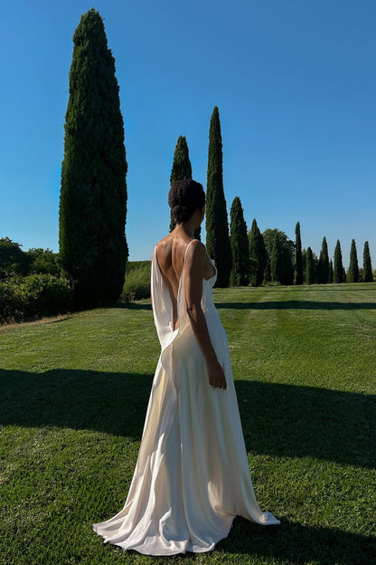 Off-white dress with deep back neckline.