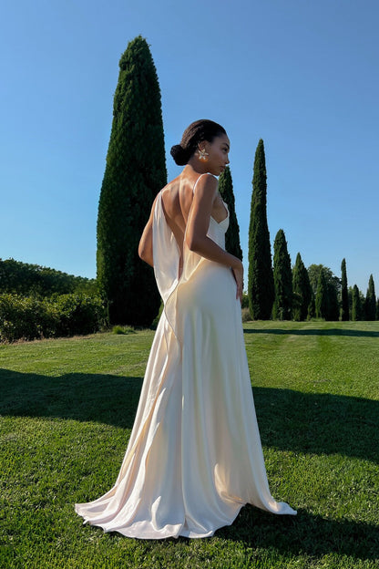 Off-white dress with deep back neckline.