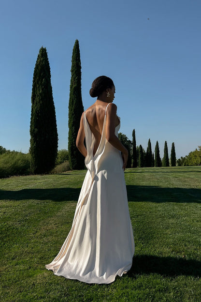 Off-white dress with deep back neckline.