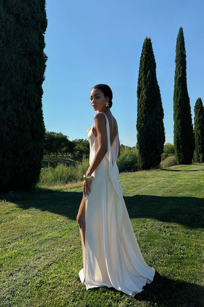 Off-white dress with deep back neckline.